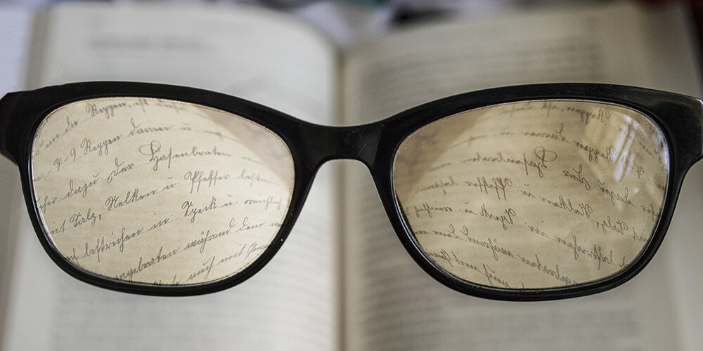 Glasses looking at a book