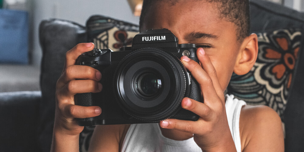 Child Holding a Camera