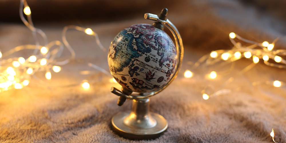 a globe on a table with lights all around it