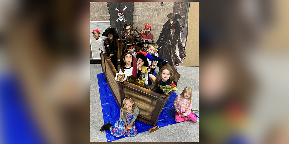 Students dressed as pirates in a pirate ship in our cafeteria