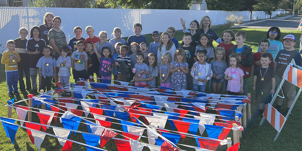 Students and parent participate in the Dragon Dash Fun Run and Obstacle Course