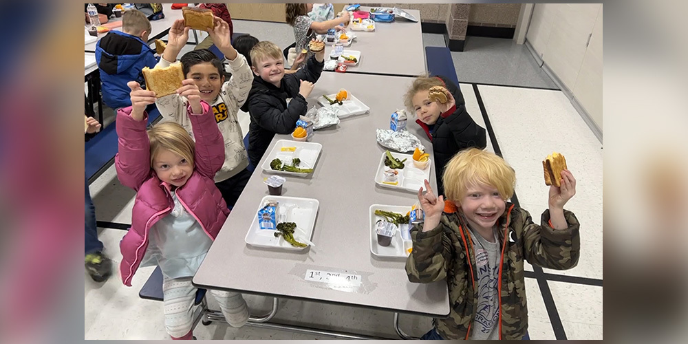 Students eating in the cafeteria.