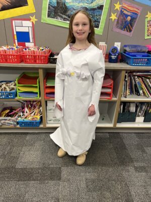 Students model their homemade fashion designs