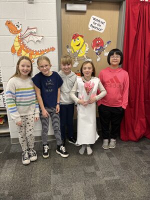 Students model their homemade fashion designs