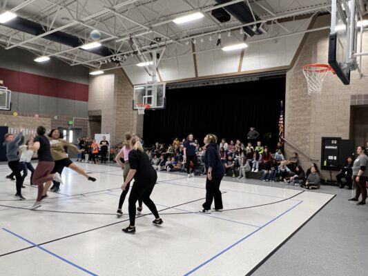 5th grade students play basketball against the teachers