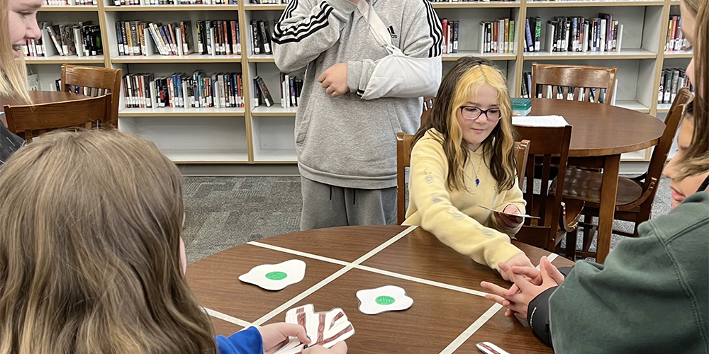 Students play a game in library