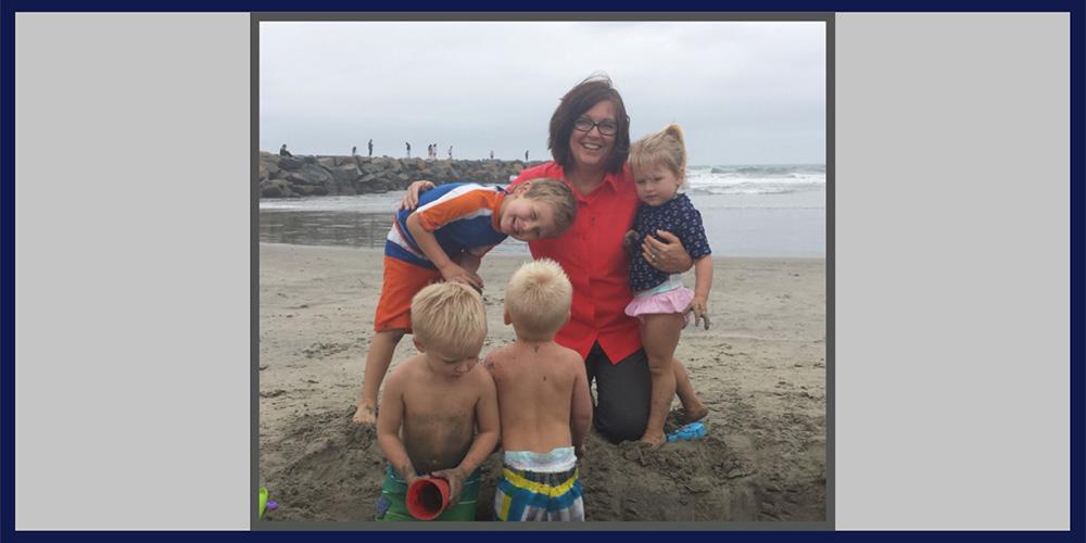 Mrs. Metz with her grandkids at the beach