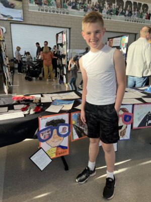 Students with their artwork at the District Art Show!