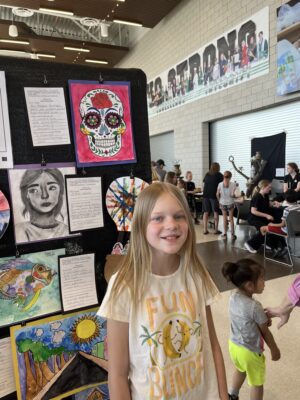 Students with their artwork at the District Art Show!