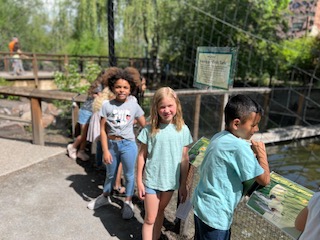 Students exploring at the Tracy Aviary.